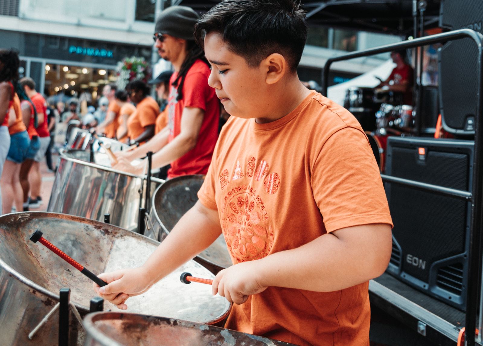 Boy playing steel pans